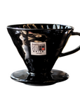 Black ceramic coffee dripper with Arita Japan logo on a white background
